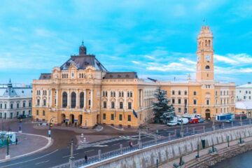 Oamenii lui Bolojan, scutiți de reforma lui Bolojan. Cazul Andrica: și director, și pensionar și 2 AGA